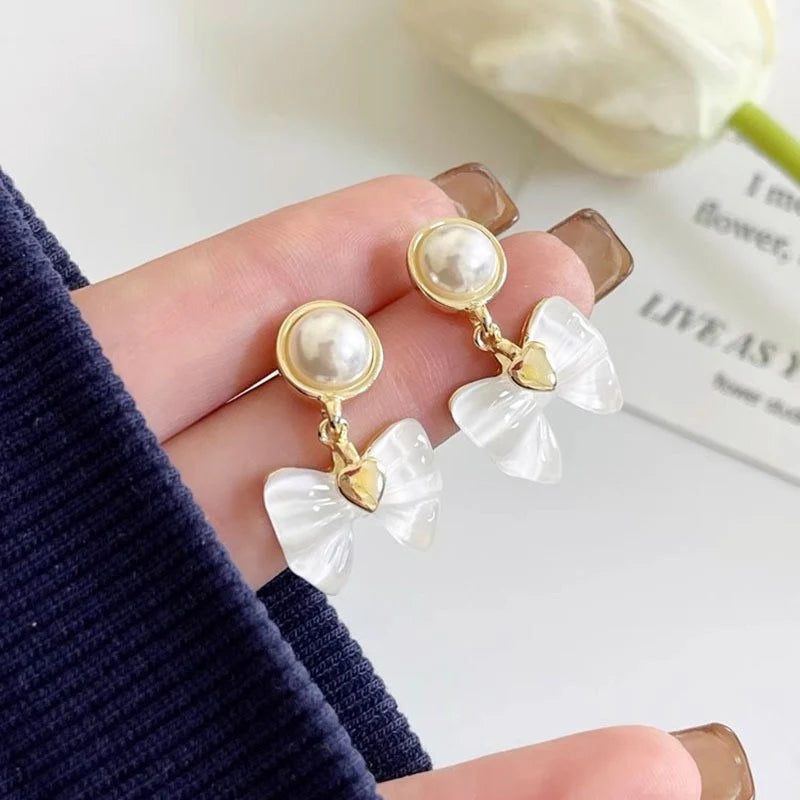 Elegant Pearl Bow Drop Earrings – Gold-Plated Heart Accent Dangle Earrings
