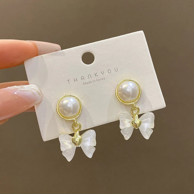 Elegant Pearl Bow Drop Earrings – Gold-Plated Heart Accent Dangle Earrings